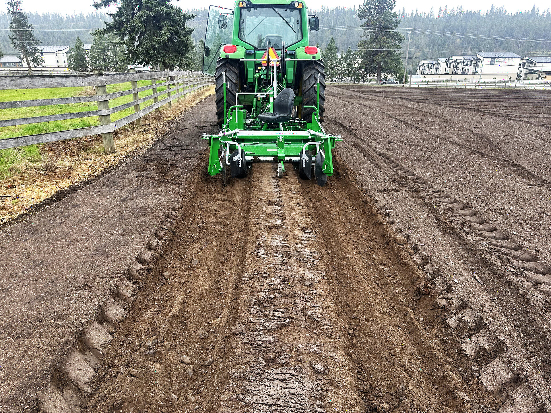 Lunceford Family Farms tractor preparing fresh rows for planting